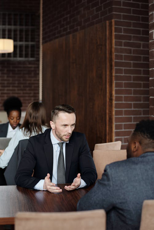 Business partners talking at a café