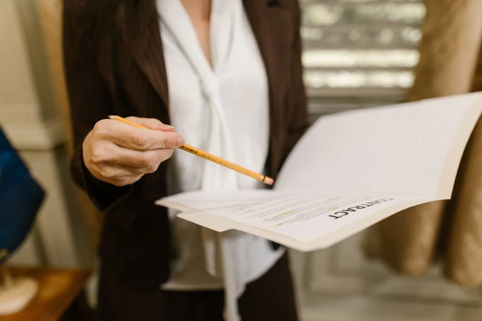 An image of a person reading a contract 